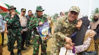 tmmd-ke-130-dibuka-di-parumpanai-bupati-irwan-pembangunan-ha TMMD ke-130 Dibuka di Parumpanai, Bupati Irwan: Pembangunan Harus Sampai ke Desa