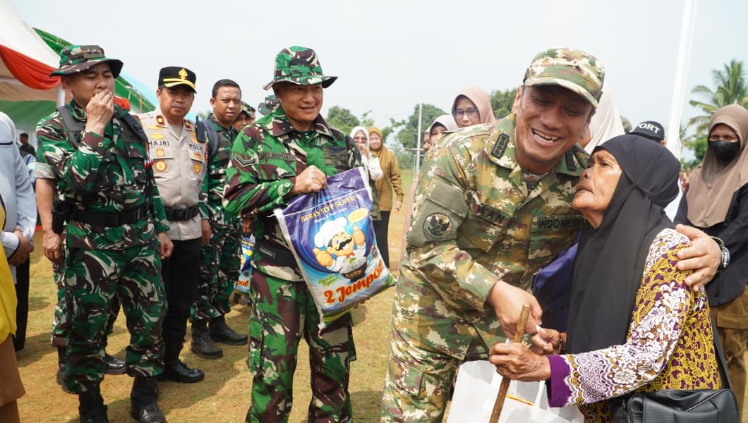 tmmd-ke-130-dibuka-di-parumpanai-bupati-irwan-pembangunan-ha TMMD ke-130 Dibuka di Parumpanai, Bupati Irwan: Pembangunan Harus Sampai ke Desa